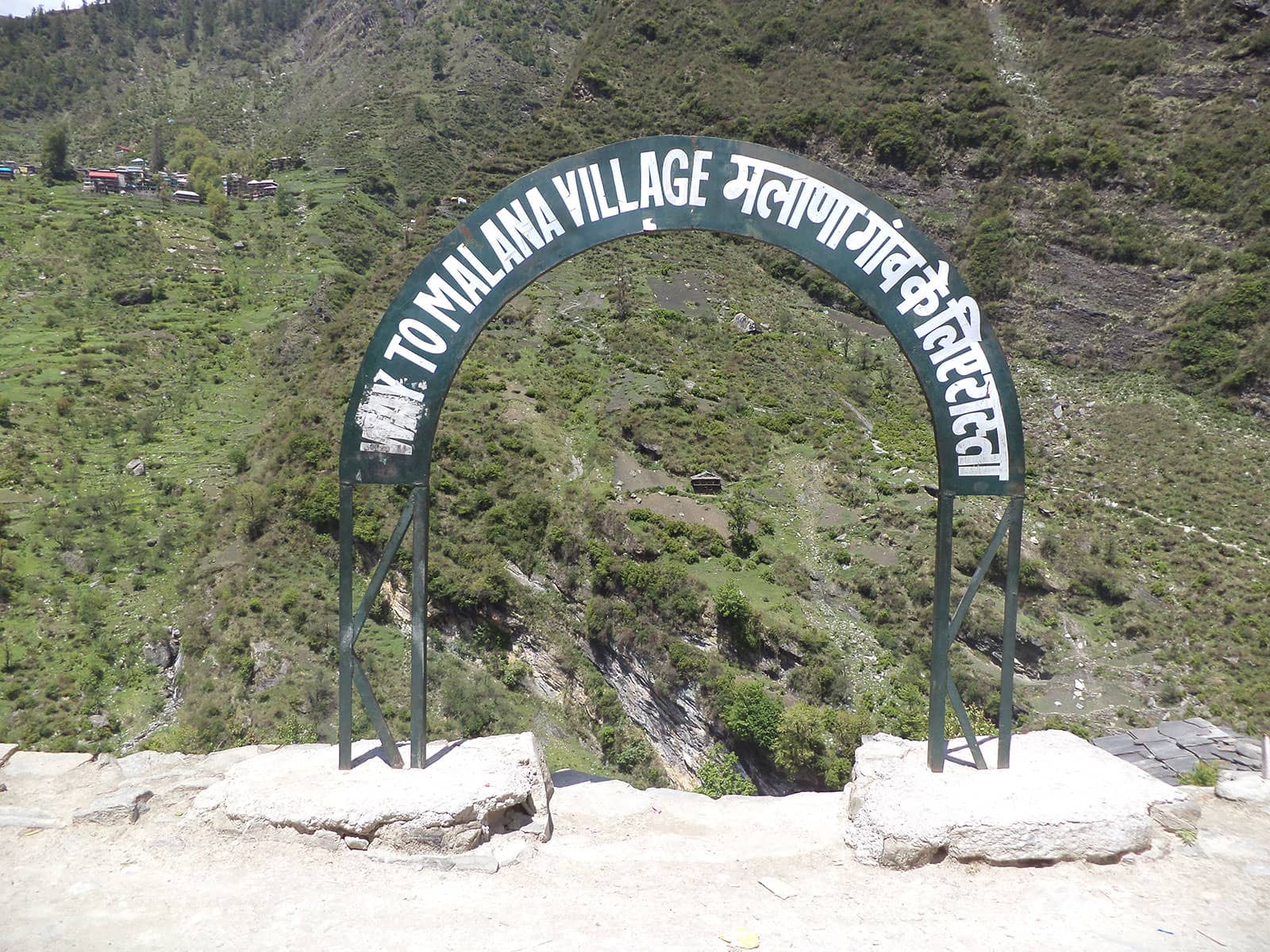 A welcome sign on reaching Malana village