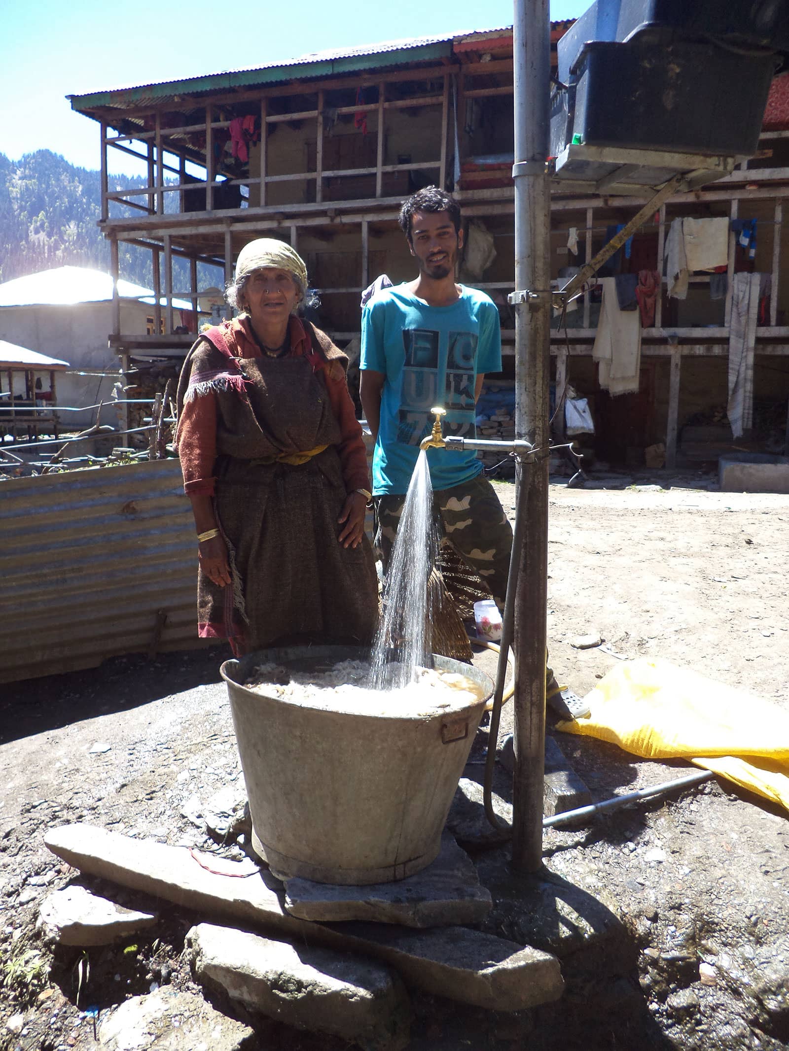 Old woman cleaning sheep fleece