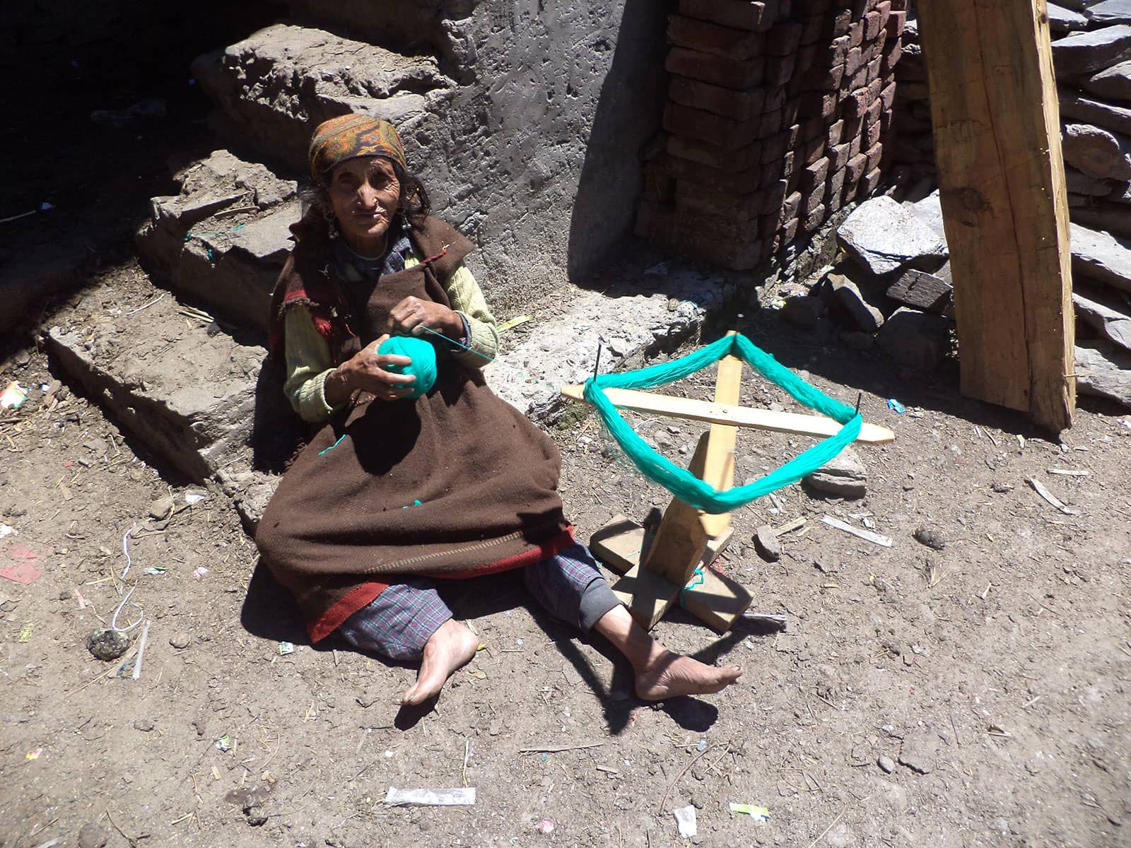 Old woman spinning yarn