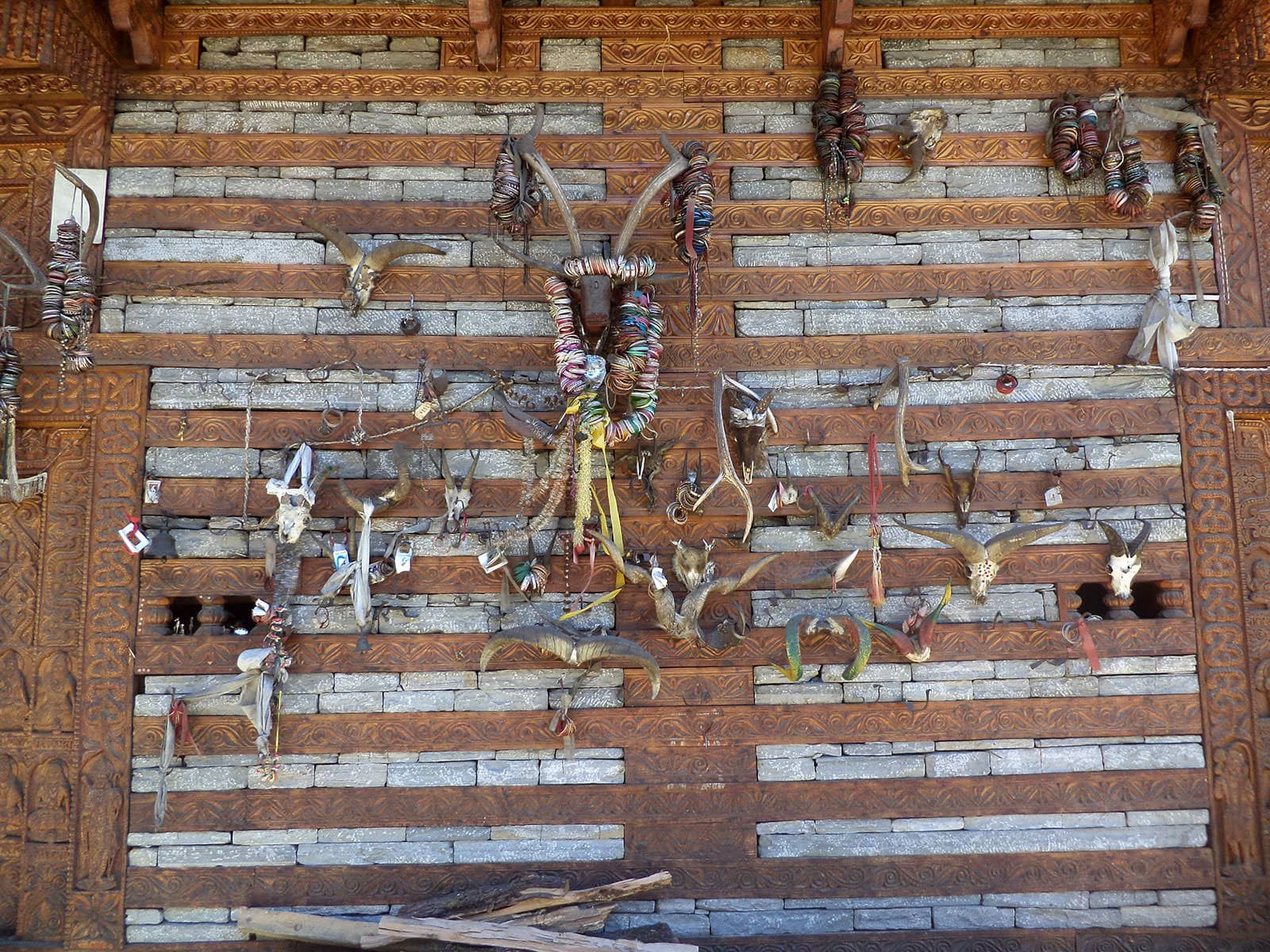 Remains of animal sacrifices hung over the walls of the twin-temple of Rishi Jamdagni